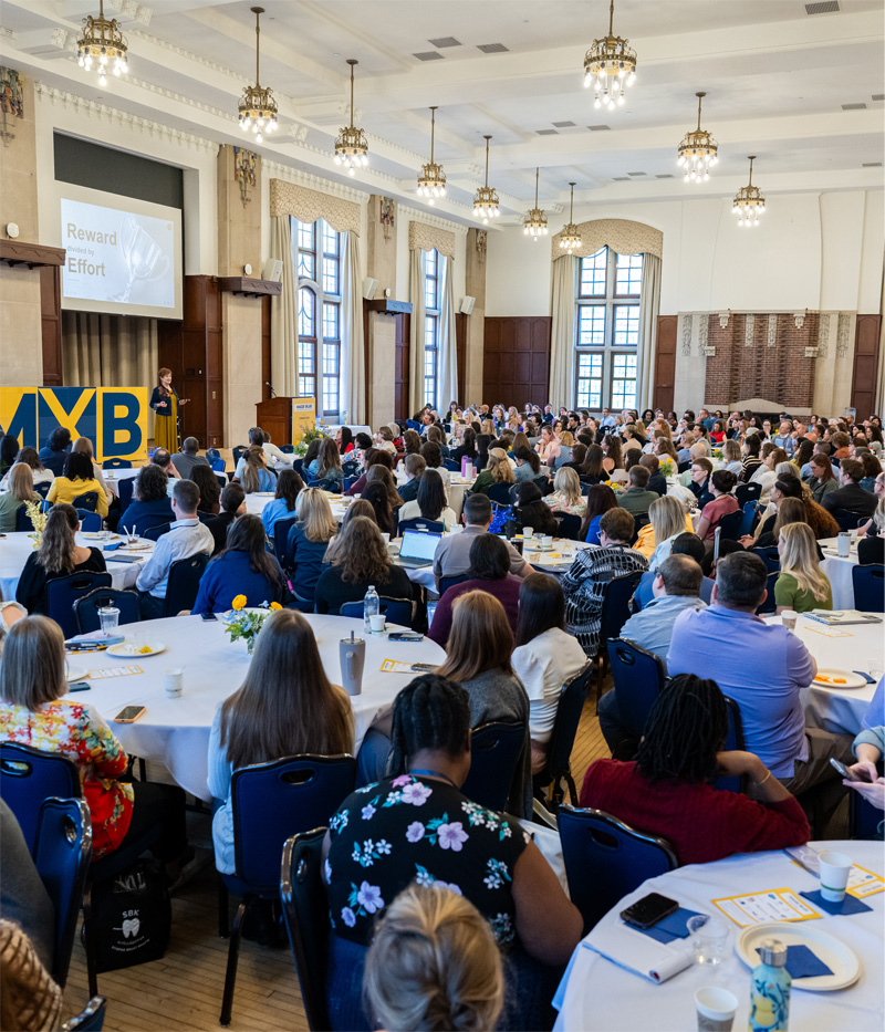 The Michigan Union ballroom full of attendees listening to a presentation at the MXB Marketing & Communications Summit.