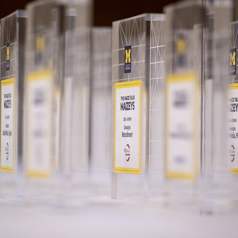 A side view of several glass Maizey awards.
