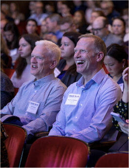 Audience members enjoying a talk