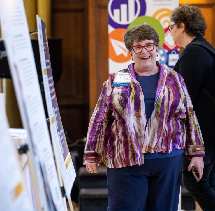 a person standing next to posters